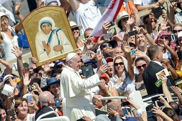 Pope Francis waves to faithful as he leaves after a Holy Mass and the canonisation of Mother Teresa of Kolkata on Saint Peter square in the Vatican