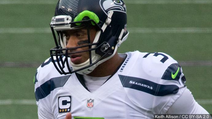 As Dolphins Players Kneel for Anthem, Russell Wilson and the Seahawks Do Something Very Different