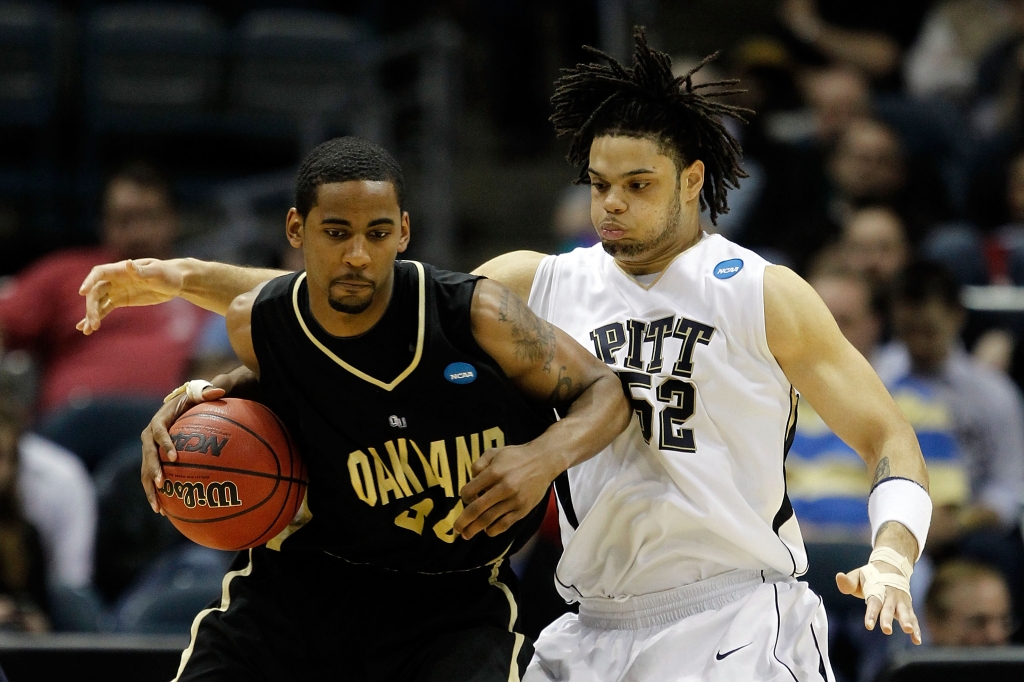 Keith Benson #34 of the Oakland Golden Grizzlies posts up Gary Mc Ghee #52 of the Pittsburgh Panthers in the second half during the first round of the 2010 NCAA men's basketball tournament at the Bradley Center