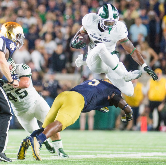 Irish junior linebacker Nyles Morgan dives to tackle the ball carrier during Notre Dame's 36-28 loss to Michigan State on Saturday