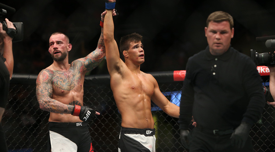 Mickey Gall celebrates his victory over CM Punk during UFC 203