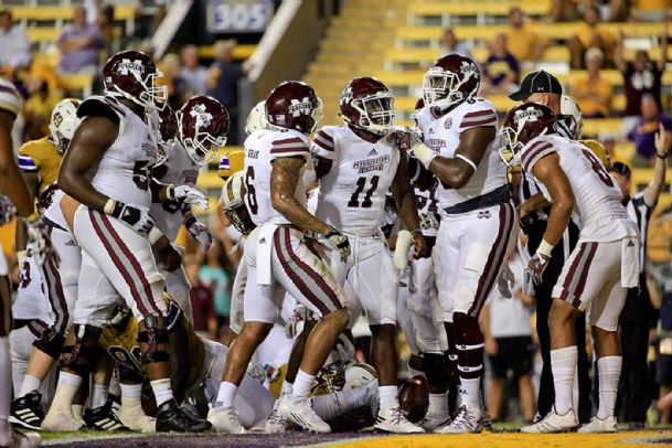 Mississippi State quarterback Damian Williams and his teammates celebrate a fourth-quarter touchdown Saturday night during a 23-20 loss at LSU