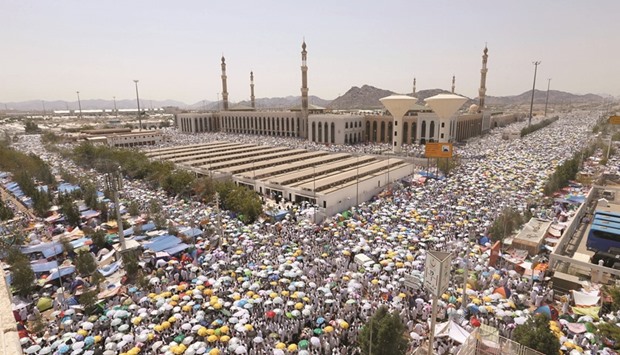 Pilgrims leave after they finished their prayers at Namirah Mosque in Arafat during the annual Haj