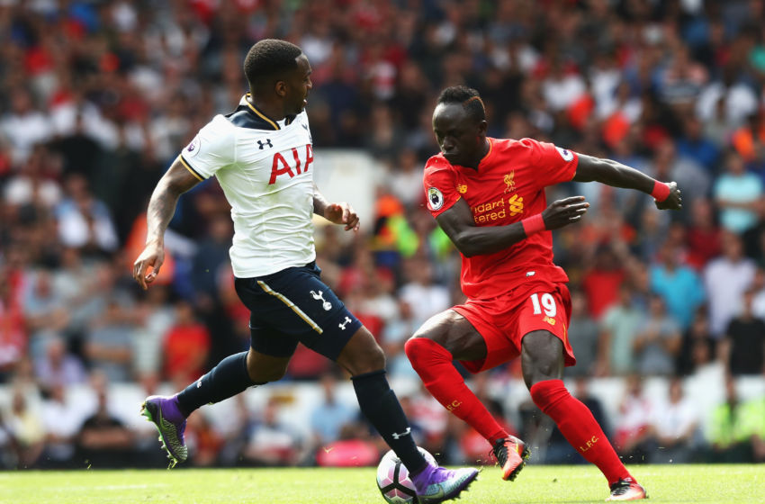 LONDON ENGLAND- AUGUST 27 Sadio Mane of Liverpool takes the ball past Danny Rose of Tottenham Hotspur during the Premier League match between Tottenham Hotspur and Liverpool at White Hart Lane