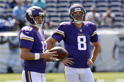 Minnesota Vikings quarterbacks Shaun Hill and Sam Bradford warm up before an NFL football game against the Tennessee Titans Sunday Sept. 11 2016 in Nashville Tenn