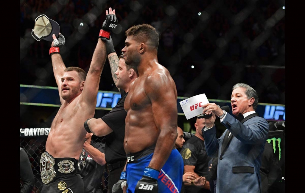 Stipe Miocic has his arm raised by the referee after defeating Alistair Overeem from the Netherlands during a heavyweight title bout at UFC 203 on Saturday Sept. 10 2016 in Cleveland