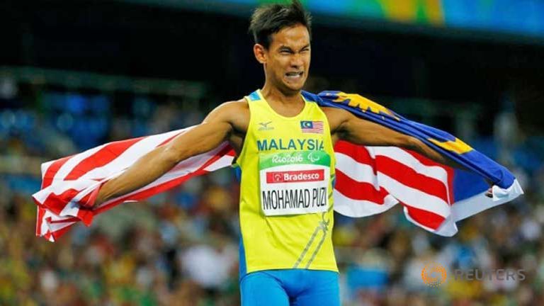 Mohamad Ridzuan Mohamad Puzi won the first gold for Malaysia in the 100m T36 event.
   
 

  Enlarge  Caption