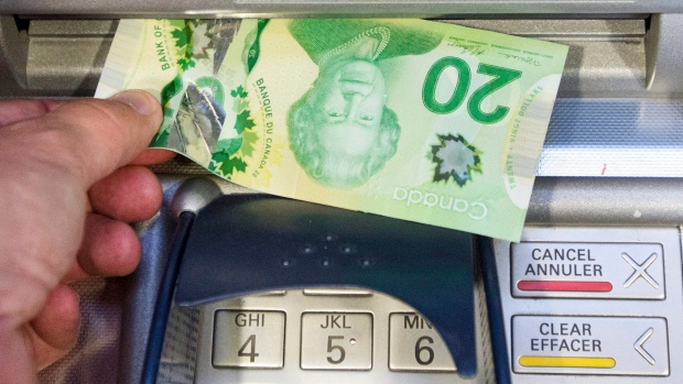 Money is removed from a bank machine Monday