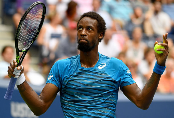 Monfils reacts to the crowd booing