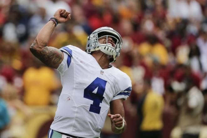 Dallas Cowboys quarterback Dak Prescott celebrates running back Albert Morris&#039 touchdown during the Cowboys 27-23 defeat of the Washington Redskins Sunday