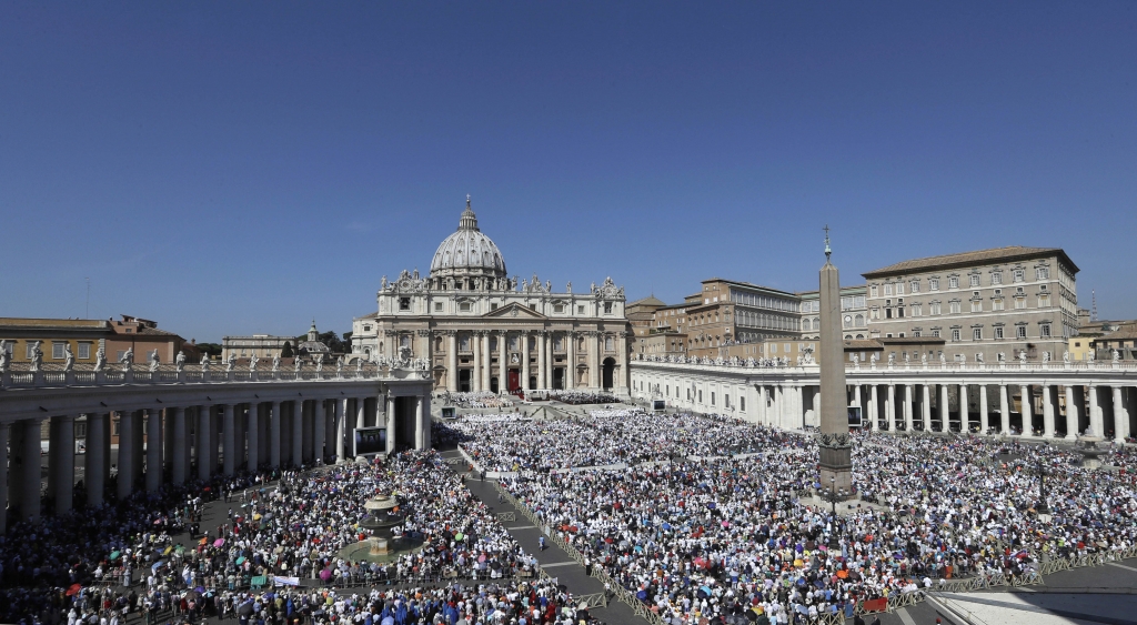 St. Peter's Square is crowded with faithful attending a Canonization Mass by Pope Francis for Mother Teresa at the Vatican Sunday Sept. 4 2016. Francis has declared Mother Teresa a saint honoring the tiny nun who cared for the world's most