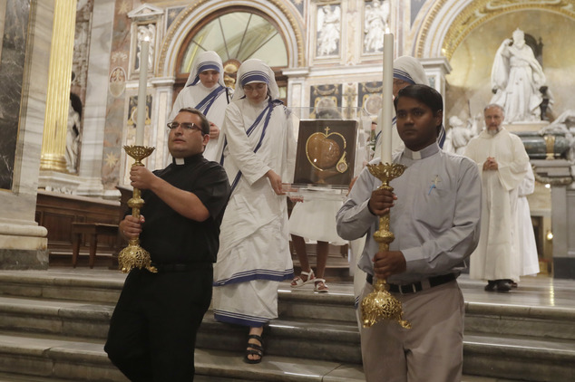 Nuns of Mother Teresa's Missionaries of Charity carry some of her relics during a vigil of prayer in preparation for the canonization of Mother Teresa in