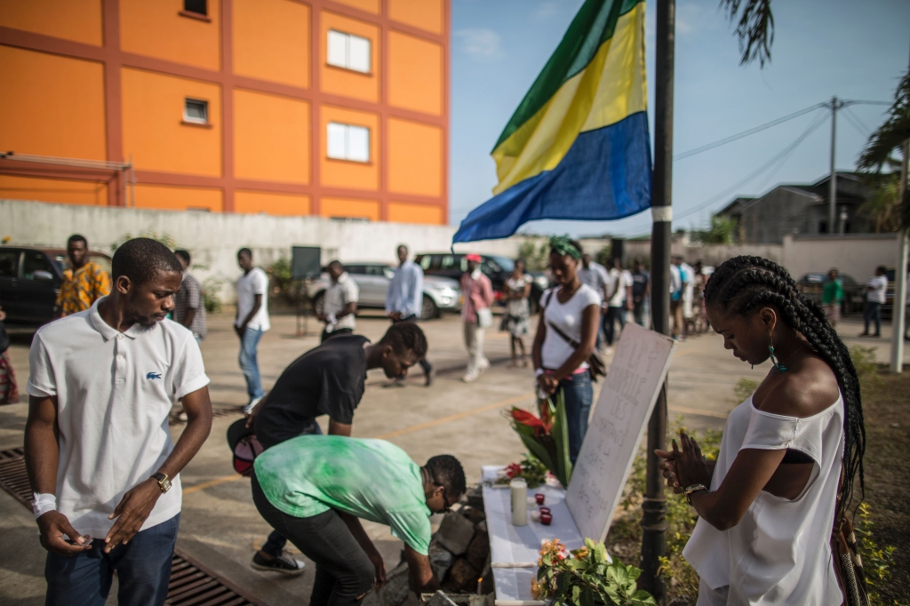 Mourners pay their respects to those who died during violence that broke out last week after the results were announcedMARCO LONGARI  AFP  Getty Images