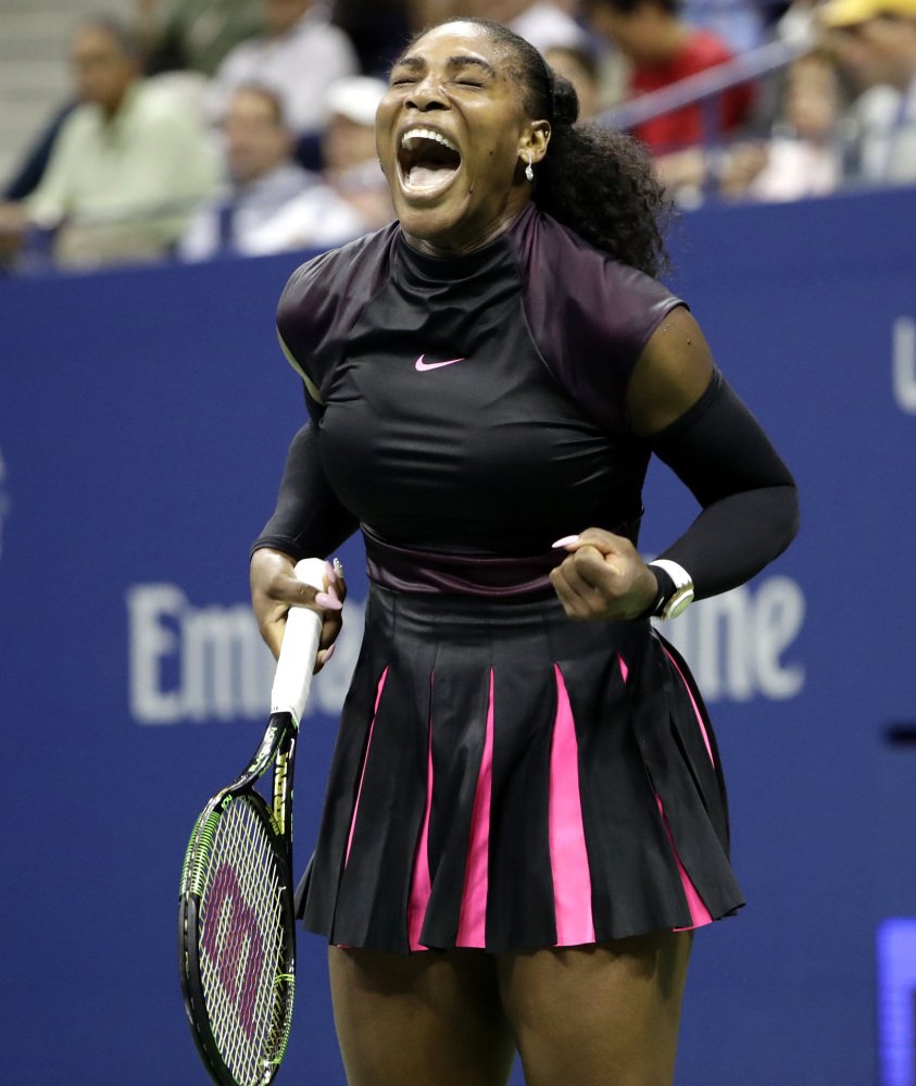 Serena Williams celebrates Wednesday night after winning a game against Simona Halep during the U.S. Open quarterfinals in New York. Williams seeking a record 23rd major championship will take on 10th-seeded Karolina Pliskova next