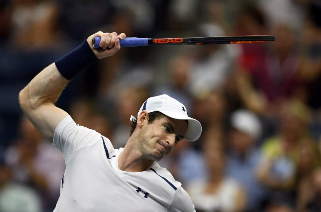 Andy Murray of Britain hits the net with his racket in dejection after losing a game against Kei Nishikori of Japan during their 2016 U.S. Open Mens Singles quarterfinal matchon Wednesday. Nishikori shocked Murray to reach U.S. Open semifinals