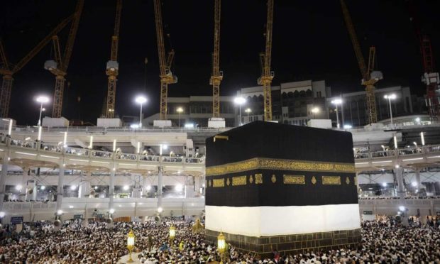 Muslim pilgrims circle counterclockwise Islam's holiest shrine the Kaaba at the Grand Mosque in the Saudi holy city of Mecca late