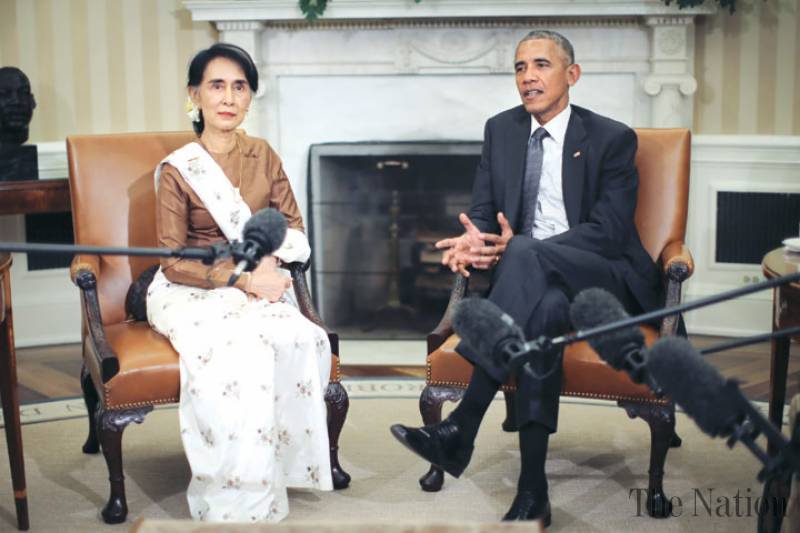 Obama vows to lift Myanmar sanctions as Suu Kyi visits