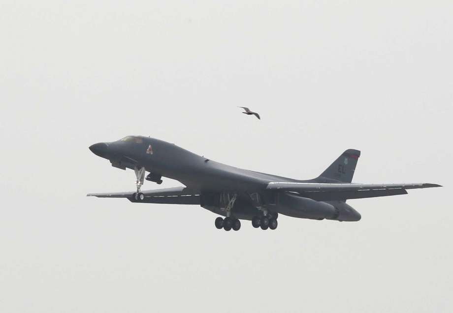 A U.S. Air Force B-1B bomber from Andersen Air Force Base Guam flies over Osan Air Base in Pyeongtaek South Korea Wednesday Sept. 21 2016. KOREA OUT