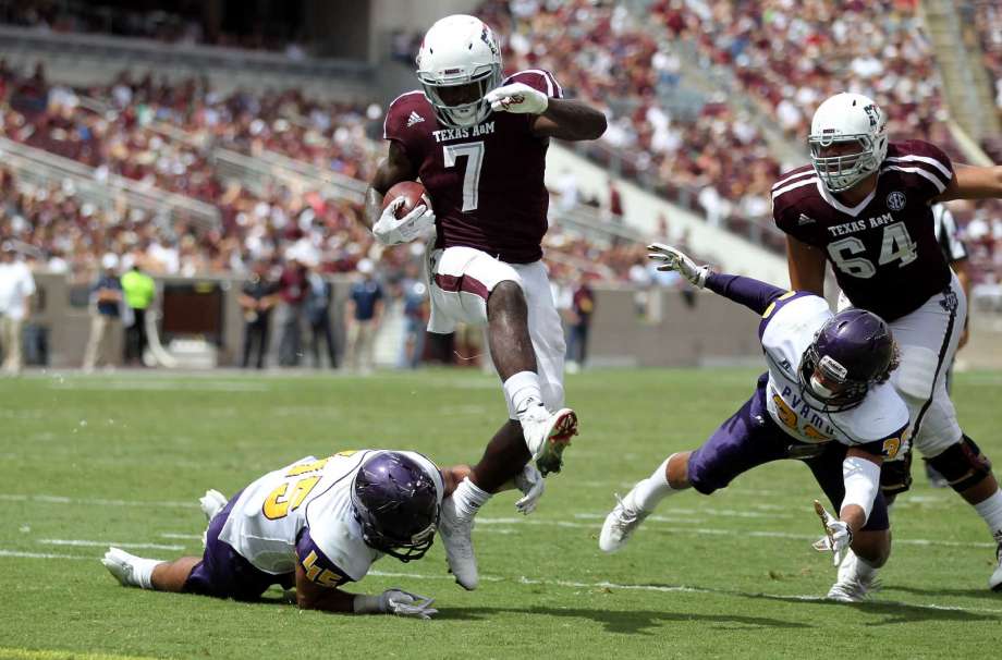 Texas A&M running back Keith Ford steps out of a tackle from Prairie View A&M linebacker Steven Guillory while on his way to the end zone for a touchdown during the second half of an NCAA college football game Saturday Sept. 10 2016 in College