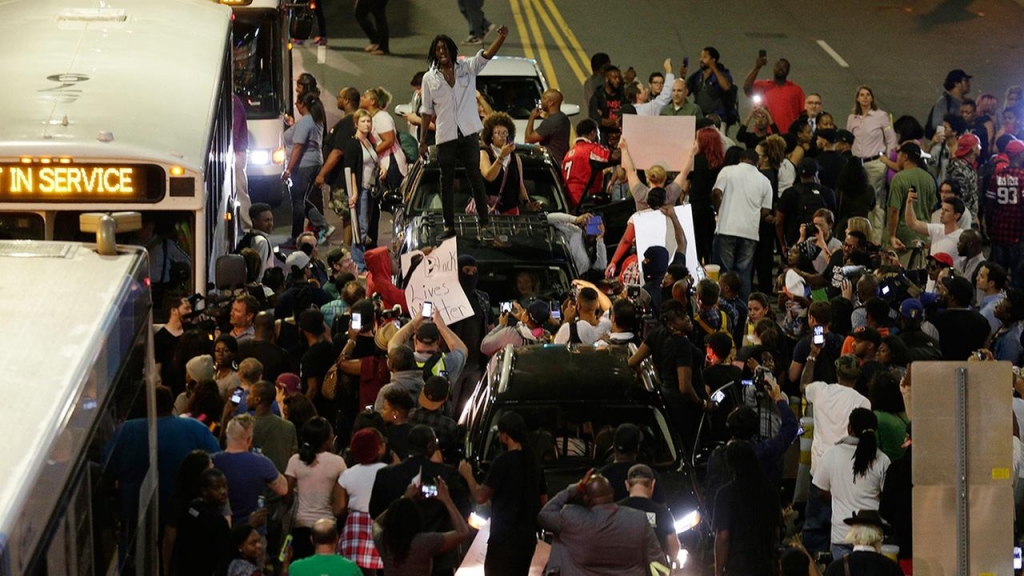 Charlotte protest turns violent as police fire tear gas at protesters