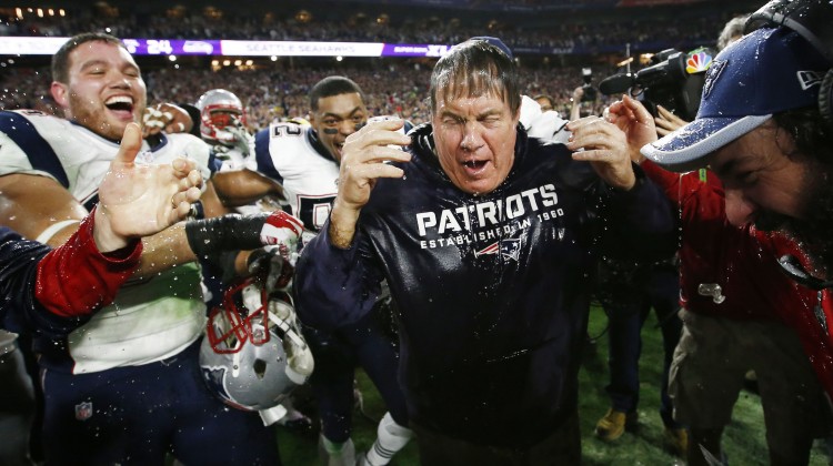 New England Patriots coach Bill Belichick gets dunk after defeating Seattle at Super Bowl XLIX on Sunday Feb. 1 2015 in Glendale AZ