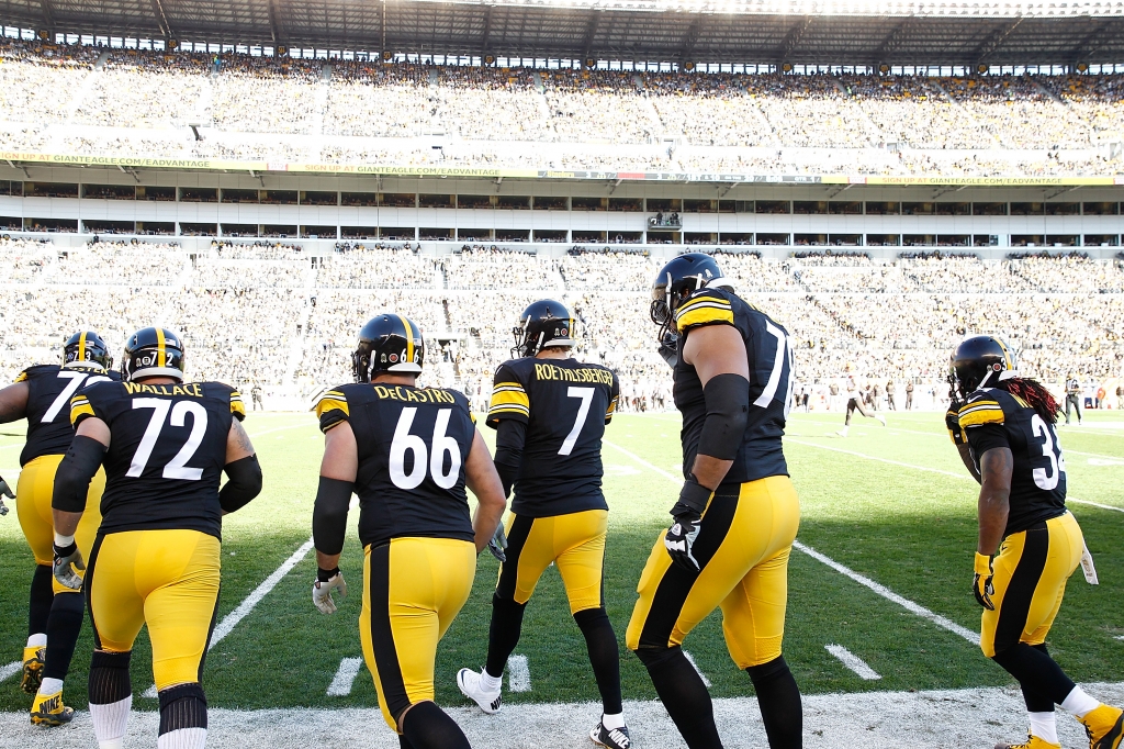 PITTSBURGH PA- NOVEMBER 15 Ben Roethlisberger #7 and the offensive line of the Pittsburgh Steelers take the field during the 1st quarter of the game against the Cleveland Browns at Heinz Field