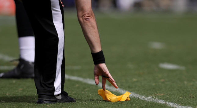 BALTIMORE MD- SEPTEMBER 11 A referee picks up a penalty flag in the first half as the Buffalo Bills play the Baltimore Ravens at M&T Bank Stadium