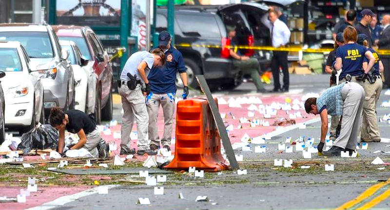 Federal Bureau of Investigation and other security officials mark evidence near the site of an explosion which took place on Saturday night in the Chelsea neighborhood of Manhattan New York