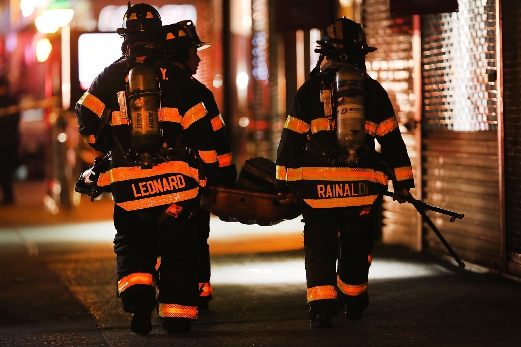 Police firefighters and emergency workers gather at the scene of an explosion in Manhattan