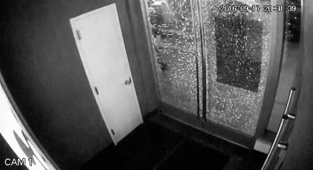 In this Saturday Sept. 17 2016 frame from video provided by Orangetheory Fitness Chelsea a door shatters after an explosion in the Chelsea neighborhood of New York. Investigators scrambled Sunday to find out who planted a bomb that rocked Chelsea scou