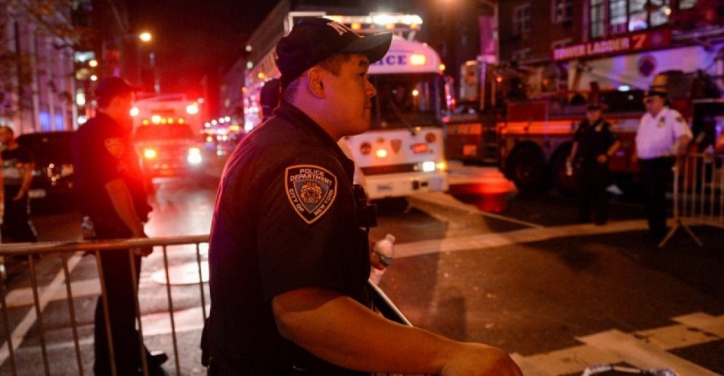 New York City Police Department officer stands guard near the site of an explosion in the Chelsea neighborhood of Manhattan New York U.S