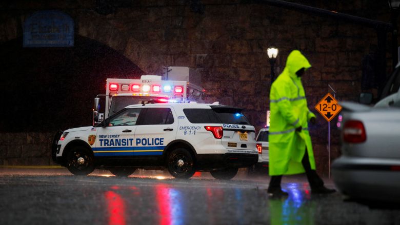 A police officer walks near an area where an explosive device left at a train station was detonated by the authorities in Elizabeth New Jersey U.S