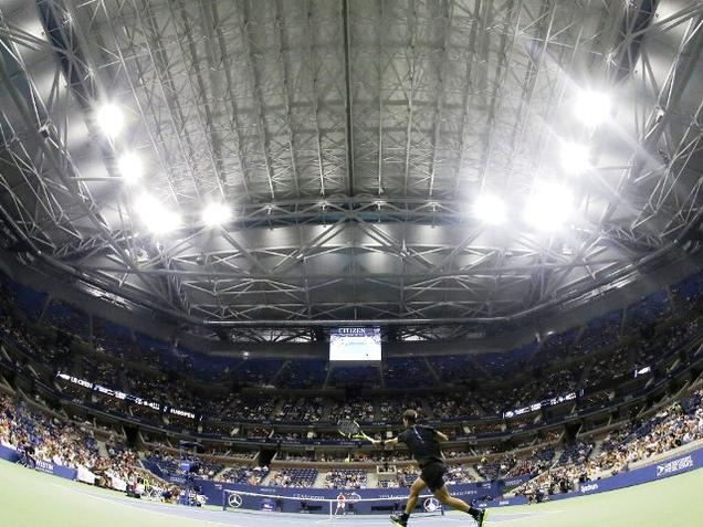 With the roof closed at Arthur Ashe Stadium Rafael Nadal of Spain returns a shot to Andreas Seppi of Italy during the U.S. Open tennis tournament in New York on Wednesday