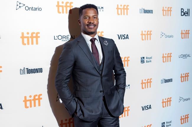 Director Nate Parker arrives on the red carpet for the film'Birth of a Nation during the 2016 Toronto International Film Festival in Toronto on Friday