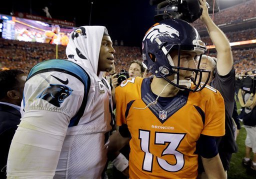 Carolina Panthers quarterback Cam Newton greets Denver Broncos quarterback Trevor Siemian after an NFL football game Thursday Sept. 8 2016 in Denver. The Broncos won 21-20