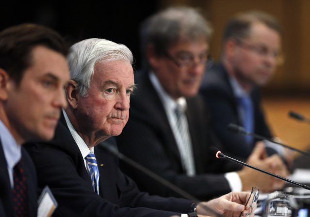 Craig Reedie second from left president of the World Anti Doping Agency, listens to a question during a news conference following a meeting in which WADA leadership voted to declare Russia's anti-do