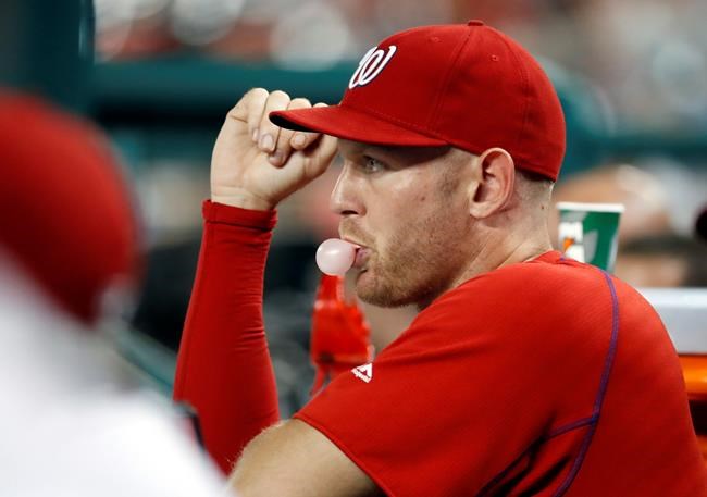 Washington Nationals pitcher Stephen Strasburg blows a bubble on the bench during a baseball game against the Philadelphia Phillies at Nationals Park Thursday Sept. 8 2016 in Washington. Strasburg left Wednesday's game with an injury. The Phillies