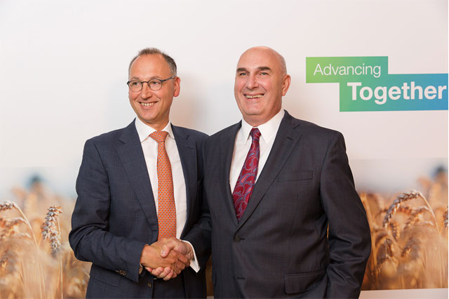 Bayer CEO Werner Baumann and Monsanto CEO Hugh Grant shaking hands after announcing the signing of the merger agreement