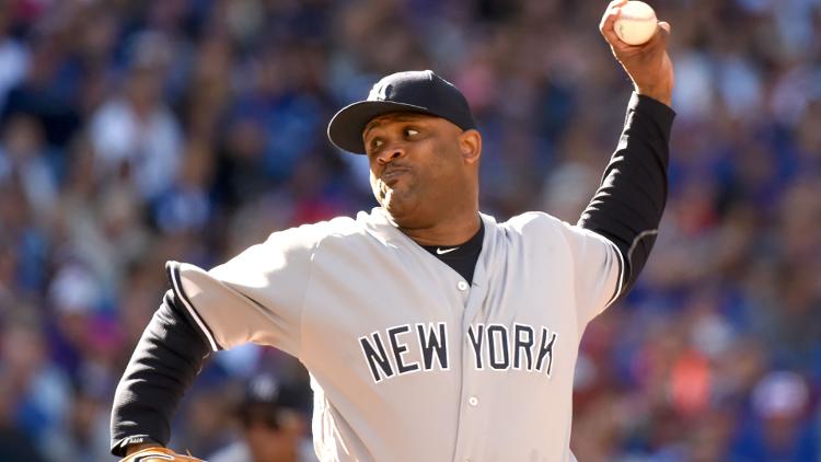 New York Yankees starting pitcheer CC Sabathia delivers a pitch against Toronto Blue Jays at Rogers Centre