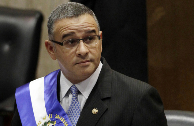 El Salvador's President Mauricio Funes stands in the National Assembly before speaking to commemorate the anniversary