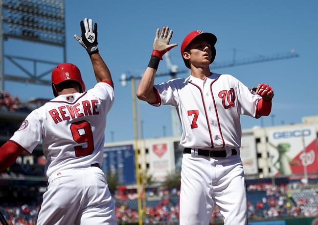 Washington Nationals&#39 Trea Turner celebrates his home run with Ben Revere during the first inning of a baseball game against the Colorado Rockies Sunday Aug. 28 2016 in Washington