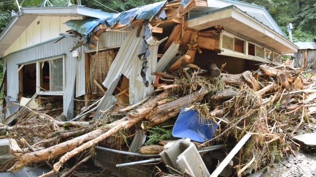 A residential house is damaged by driftwood in Kuji city in northern Japan after Typhoon Lionrock hit the region bringing heavy rains