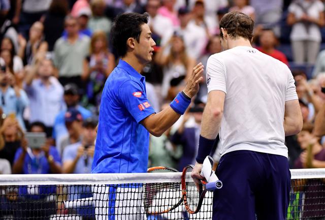 Nishikori and Murray shake hands at the net after the match