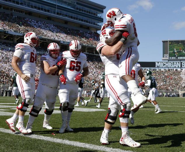 Wisconsin's Corey Clement right celebrates his touchdown against Michigan State with teammates from left Brett Connors Michael Deiter Olive Sagapolu (6