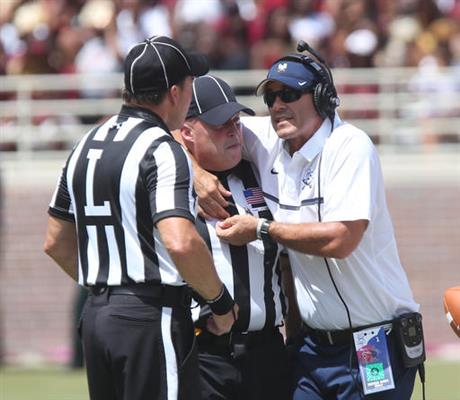 Charleston Southern head coach tries to demonstrate to officials a complaint he had with the Florida State defense in the first half of an NCAA college football game Saturday Sept. 10 2016 in Tallahassee Fla. Florida State won the game 52-8. (AP Phot