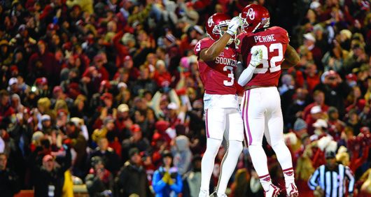 Oklahoma wide receiver Sterling Shepard and running back Samaje Perine celebrate Shepard's first-quarter touchdown against TCU at Oklahoma Memorial Stadium in Norman Okla. on Saturday Nov. 21 2015