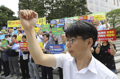 South Korean shout slogans during a rally denouncing North Korea's latest nuclear test in Seoul South Korea Monday Sept. 12 2016. North Korea is capable of detonating another nuclear device anytime at one of its unused tunne