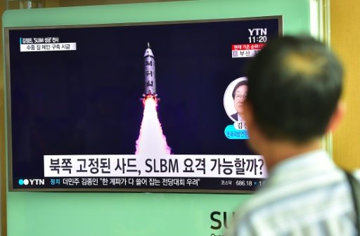 A man watches a television screen reporting news of North Korea's latest submarine-launched ballistic missile test at a railway station in Seoul on Aug 25 2016. AFP File