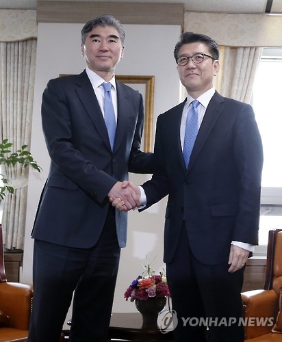 Amb. Sung Kim, U.S. special envoy for North Korea policy shakes hands with his South Korean counterpart Kim Hong-kyun during a meeting in Seoul in March