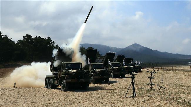 A projectile is launched from a South Korean Army 130mm Multiple Rocket Launcher during a live fire exercise in the eastern coastal county of Goseong which borders North Korea